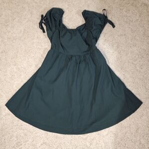 Dark Green Dress with Puff Bow Tie Sleeve and Open Back With Bow Tie also.